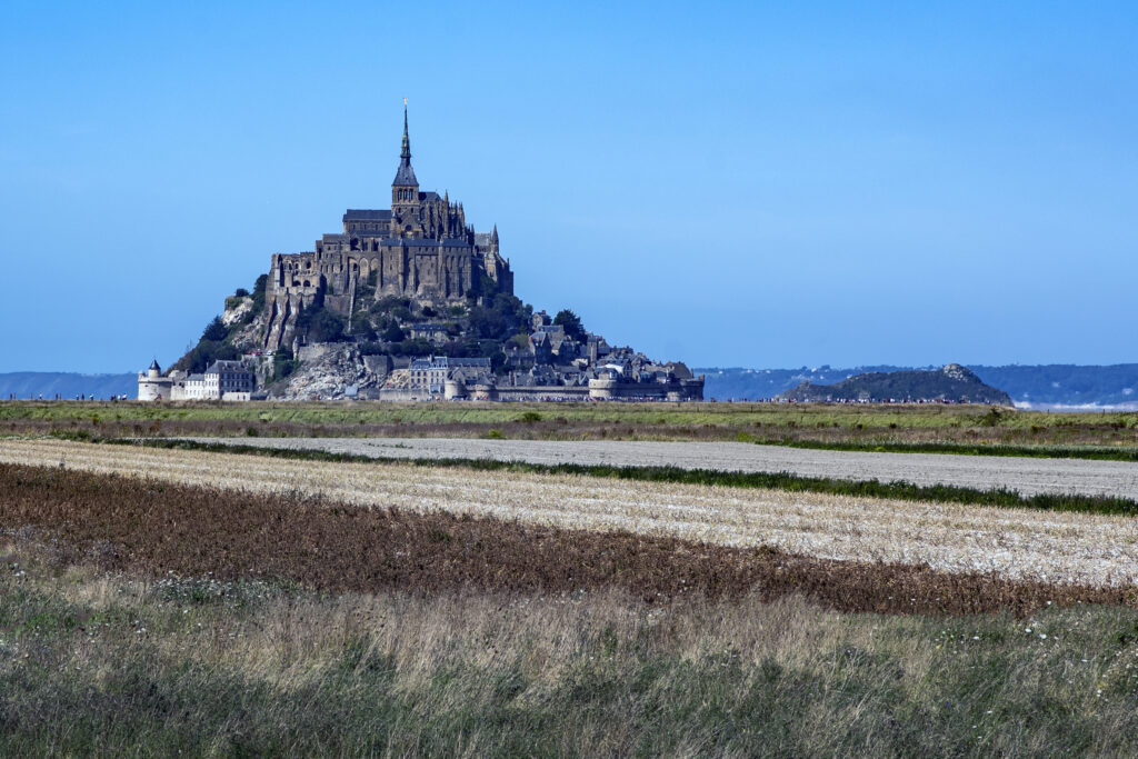 Distant view of Mont Saint Michel sticking out on the horizon